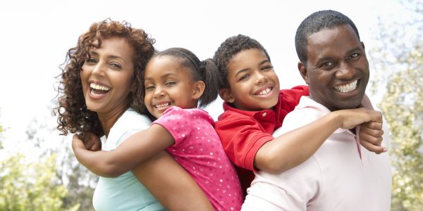 Portrait of Happy Family In Park